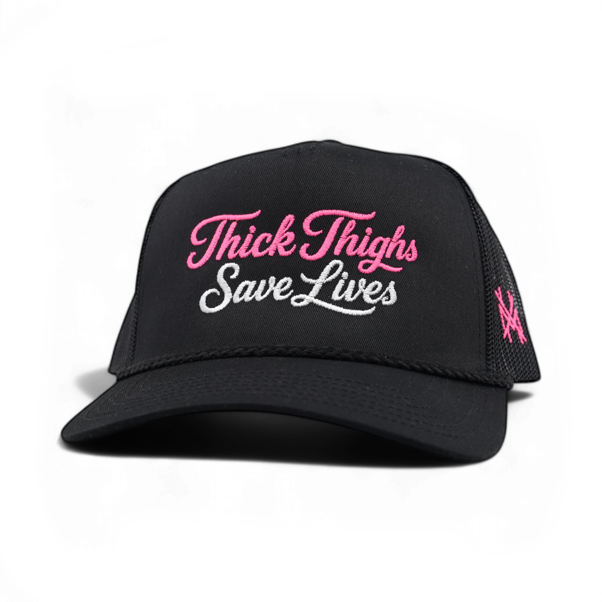 A black trucker-style cap with pink and white embroidered text reading 'Thick Thigs Save Lives' on the front, plus a pink embroidered logo on the side mesh, shown on a clean white background.