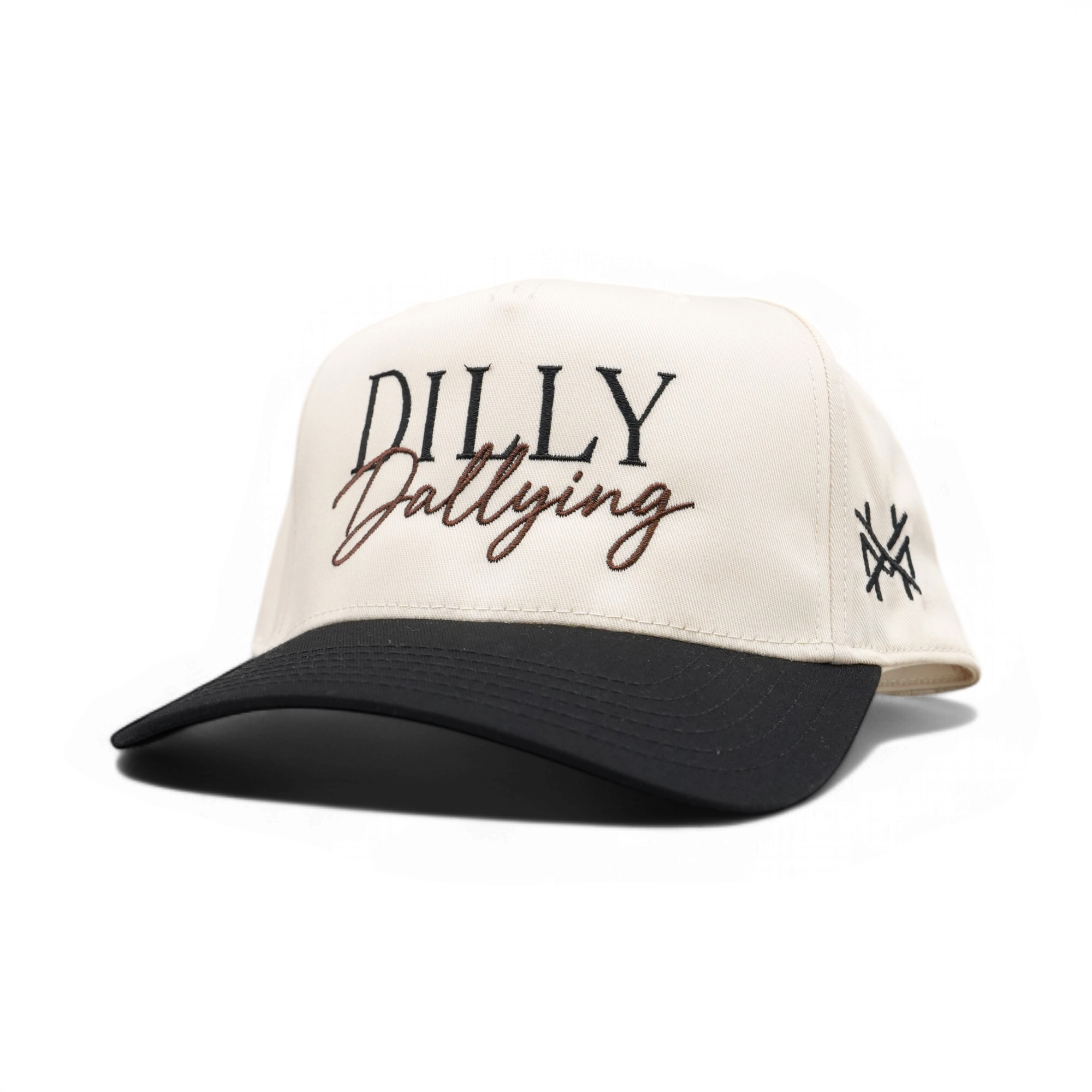 An off-white trucker-style baseball cap with a black curved brim. The front features embroidered text reading 'DILLY Dallying' in black and brown, and a small black embroidered logo on the side.