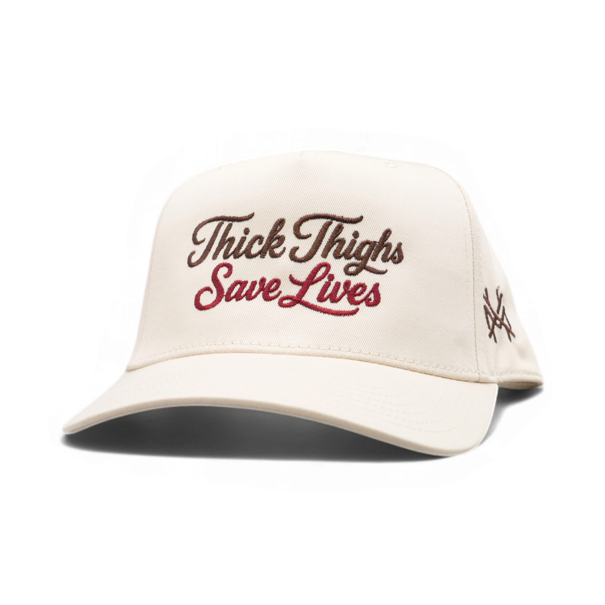 An natural trucker cap with 'Thick Thigs Save Lives' embroidered on the front in brown and red script, and a small embroidered logo on the side, shown on a white background.