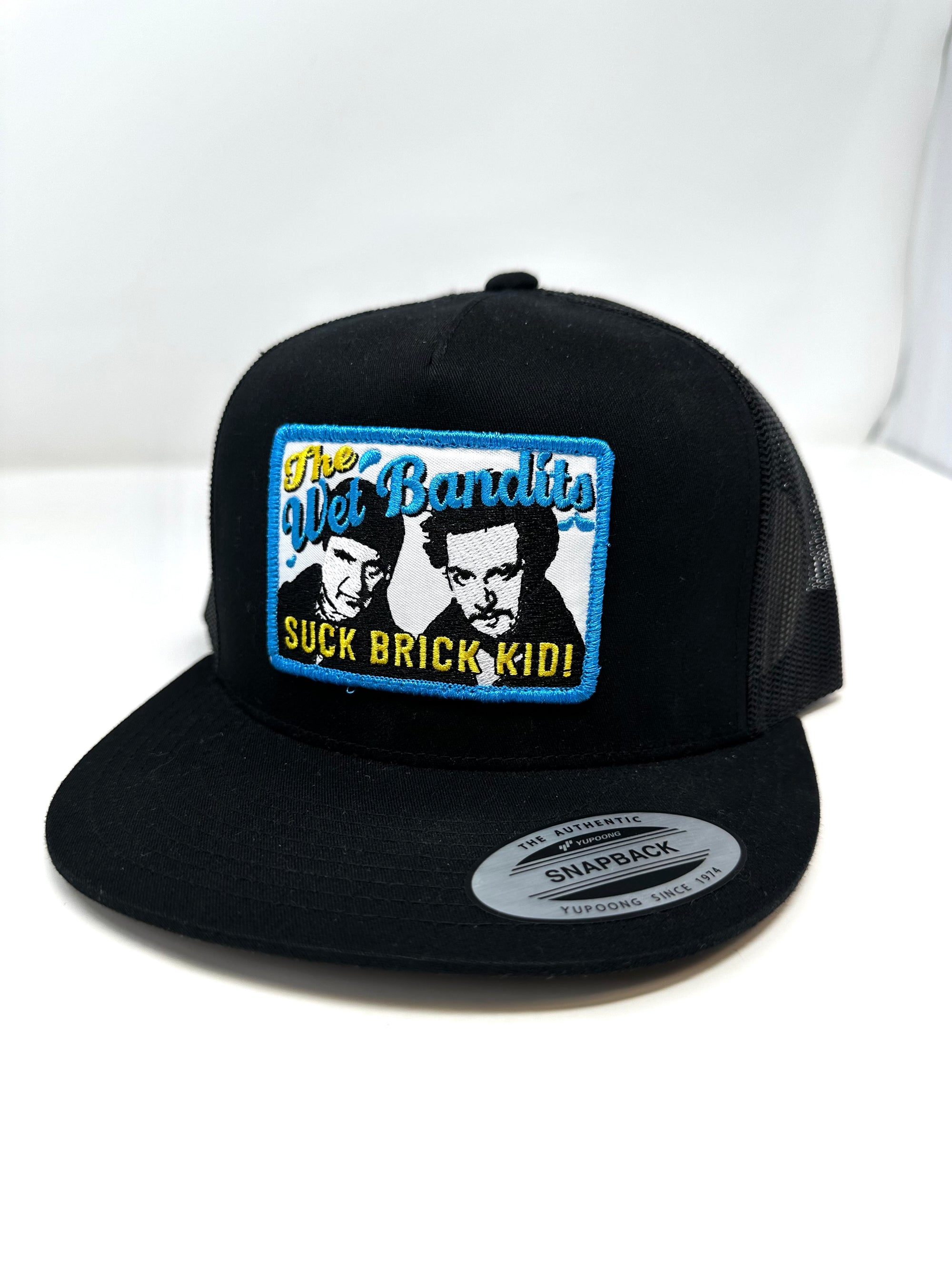 Yupoong Black The Wet Bandits snapback hat by The Mad Hatter Company, front view showing logo and structured cap design