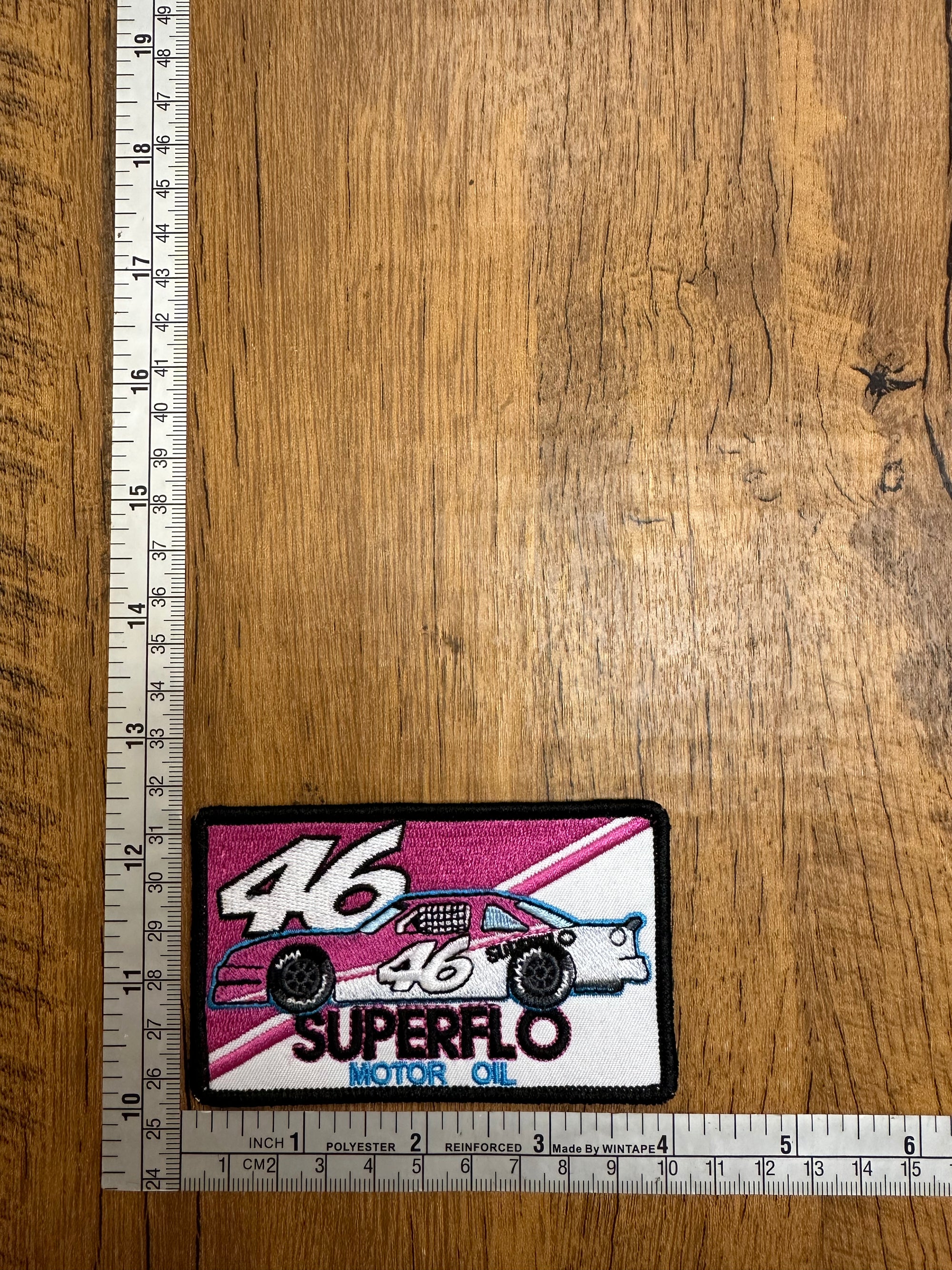 Patch featuring the 46 Superflo Motor Oil branding from The Mad Hatter Company, with vibrant colors and detailed design.
