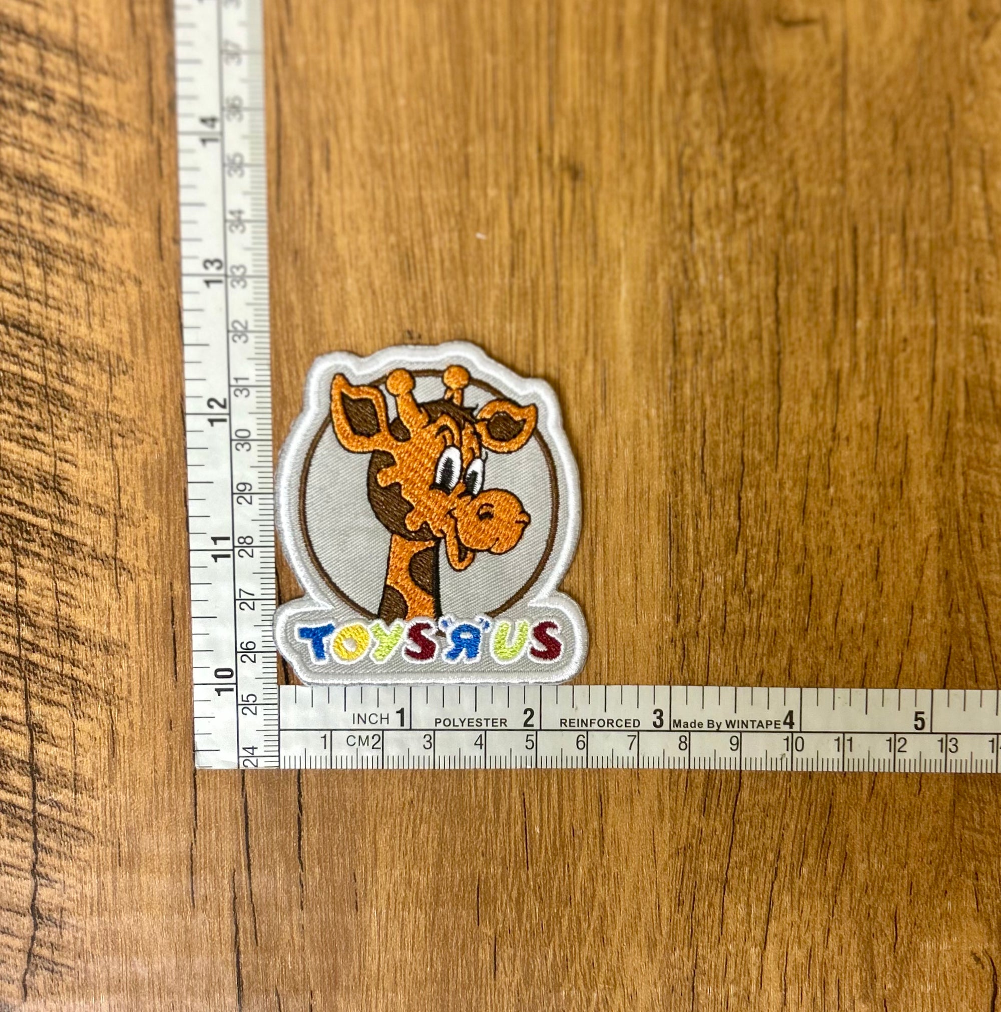 Colorful Toys R Us patch by The Mad Hatter Company featuring playful design and vibrant embroidery.