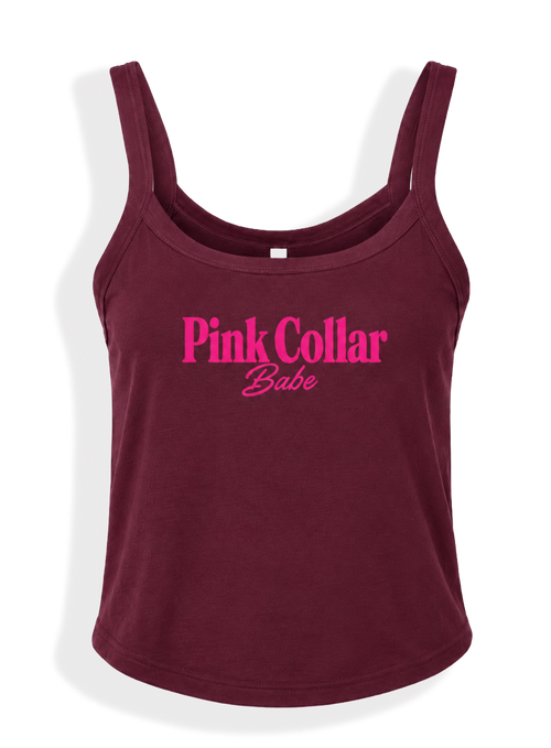 A sleeveless scoop-neck tank top in deep burgundy with 'Pink Collar Babe' printed in bright pink across the chest, shown on a clean white background.
