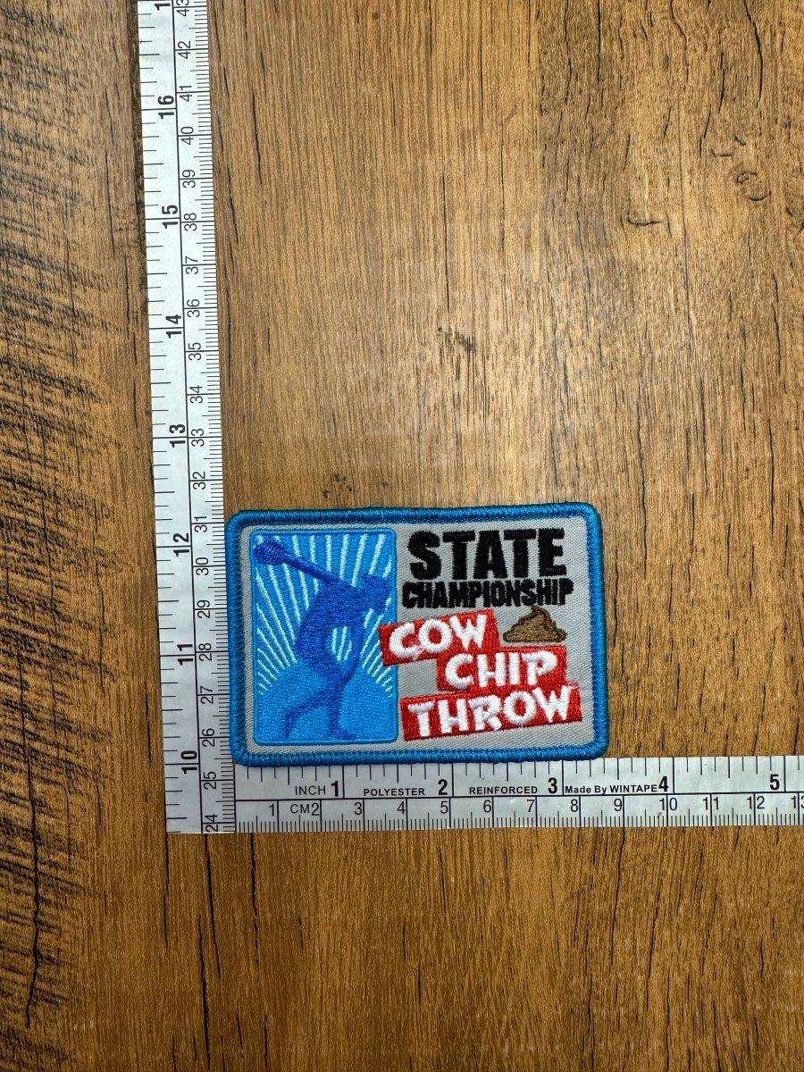 State Championship Cow Chip Throw - The Mad Hatter Company